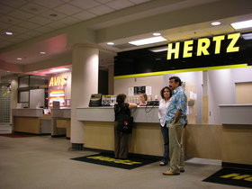 rental-car-ticket-counter-by-old-shoe-woman.jpg