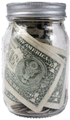 Change jar with dollar bills and coins in the money jar.